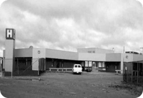 A black and white photo of Attawapiskat Hospital. 