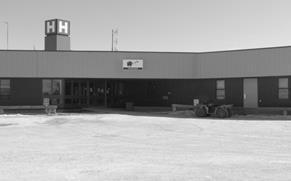 A black and white photo of Fort Albany Hospital. 