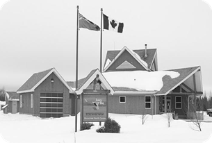A black and white photo of the Moosonee Health Centre.